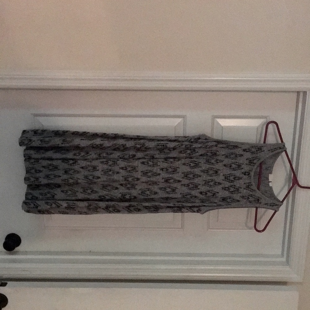 2 super soft flowy dresses, 1 is grey and black and the other is a dark grey